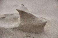 Oceanside, OR, USA beach: sand sculpted by water and wind