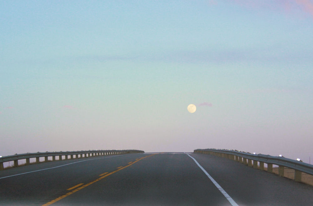 Full moon, Hwy 1 South of Calgary Full moon, Alberta Wind Energy generators are Hwy 1 South of Calgary